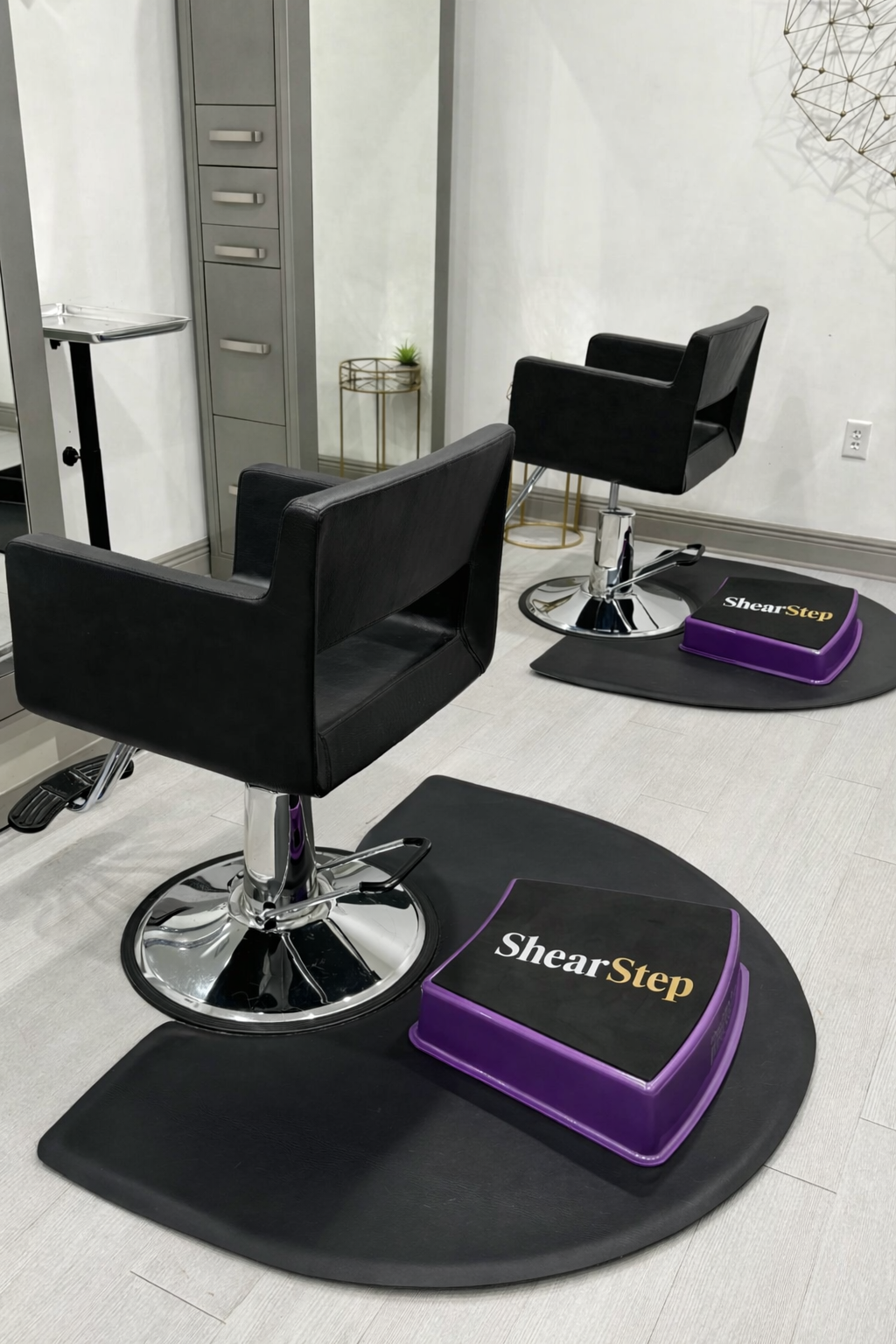 ShearStep salon step beside a modern stylist chair